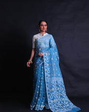 The blue cotton saree adorned with Daccai design woven intricately all over the drape,- FCT011111