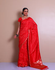 The red Banarasi handloom silk saree with small zari border and tiny zari motifs in line designs all over the drape, - BSK010760