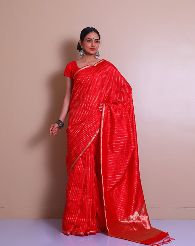 The red Banarasi handloom silk saree with small zari border and tiny zari motifs in line designs all over the drape, - BSK010760