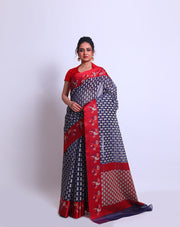 A Navy Blue Cotton saree with a contrast rust border featuring flower design sounds lovely - FCT011141!