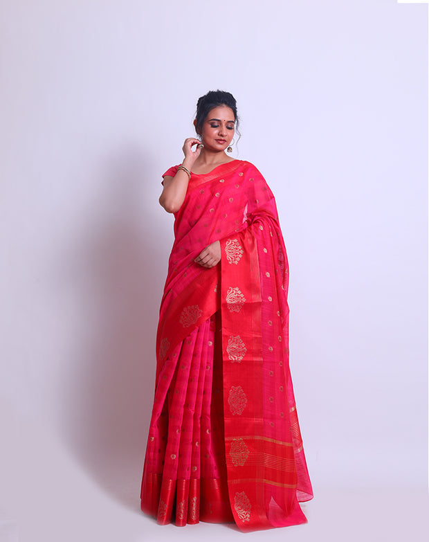 A Rani Pink Cotton saree with self lines woven all over the drape and zari buttis sounds elegant - FCT011145