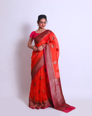 The Orange Organza Handloom saree with a contrast rani color border and pallu featuring antique zari weaving sounds stunning - BSK010449