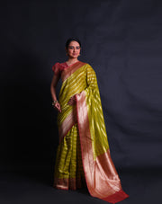 The green Banarasi cotton saree with zari horizontal lines all over the drape sounds elegant and refined.- BSK010641