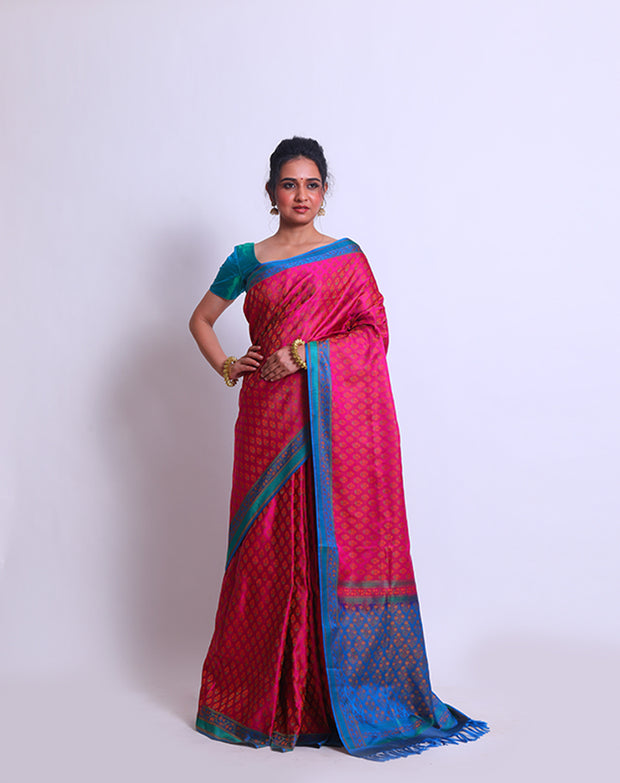 The combination of Pink Banarsi silk with a contrast blue border and pallu - BSK09553