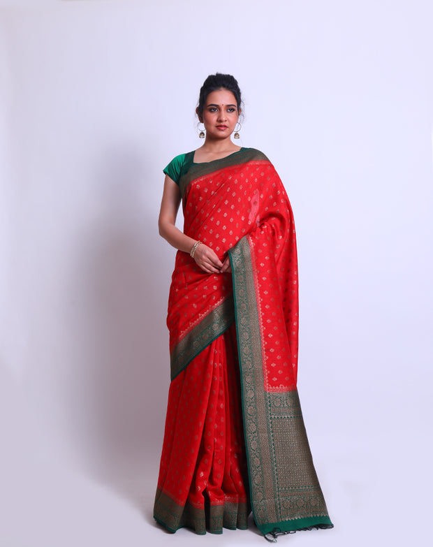 A Red Soft Silk saree with a contrast green border and pallu adorned with antique Zari - FCT011141