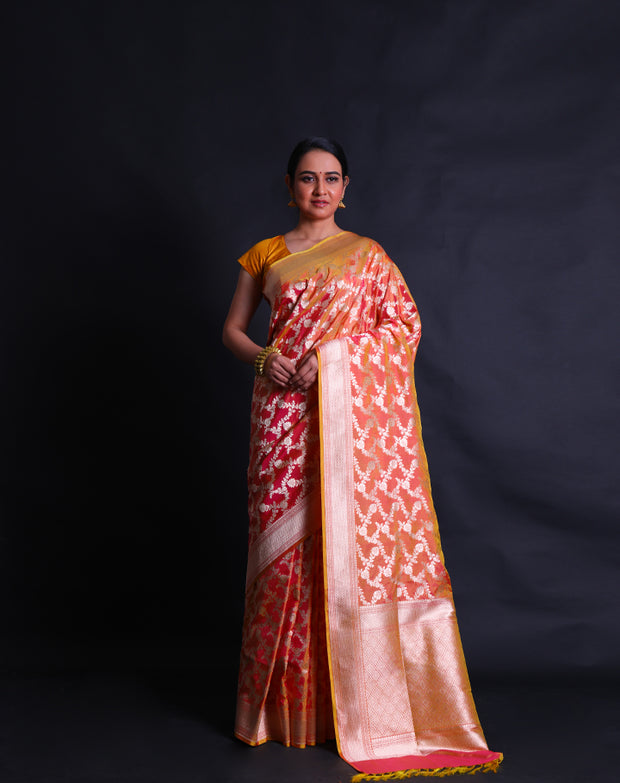 The gold spot Banarasi silk handloom saree with silver zari woven flower design.- BSK010558