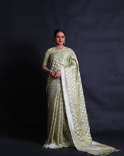 The light green Banarasi silk saree you've described sounds enchanting,- BSK010346