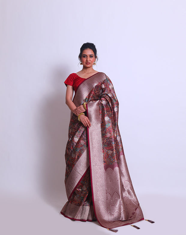 The brown blended saree with a parsley design all over the drape, accented by silver zari buttis and a rust selvage - BLN01139