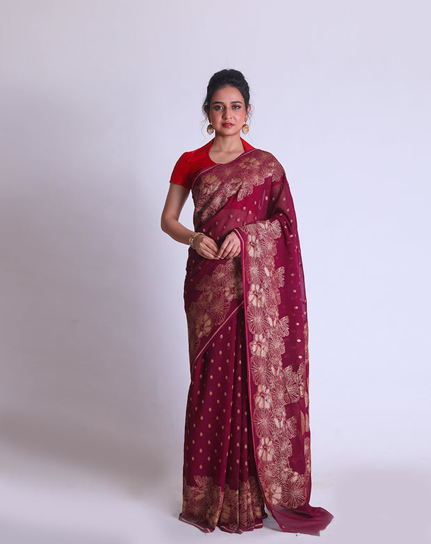 A Wine Khadi Georgette saree with Antique Zari woven on the border and pallu sounds luxurious - CHG04032