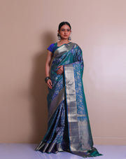 The peacock blue Kanjivaram saree with a gold design zari border - KSL03071