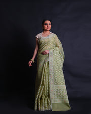 The light green cotton saree with different colored threads woven into designs as buttis.- FCT011114