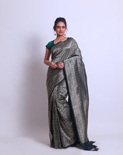 A Dark Bottle Green Handloom Silk saree with different Shikara designs in the border - BSK010299