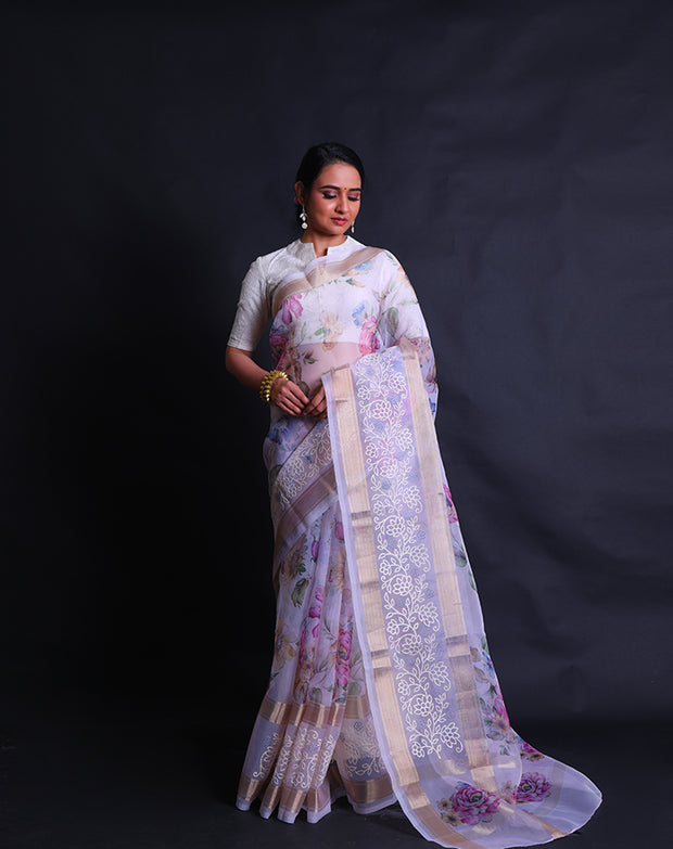 The pink organza saree with digital print in flower design all over the drape offers a modern and vibrant aesthetic.- BLN01555