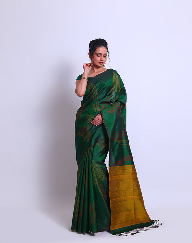 A Bottle Green South Soft Silk saree with a combination of red and yellow lines woven as a design on the border and all over the drape sounds captivating - KSL03091