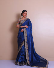 The navy blue embroidered saree with zari lines all over the drape, - EMB03353