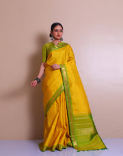 A Yellow Uppada real zari saree is adorned with small buttis of silver and gold zari scattered throughout the drape, - KSL02713