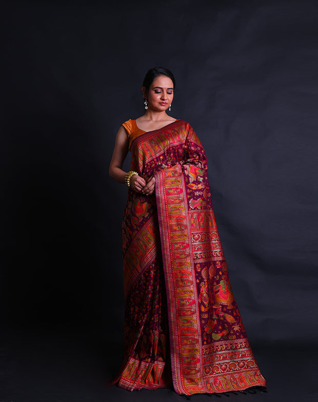 The wine blended silk saree with colorful Baluchi design woven all over the drape,- BLN00756