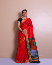 The red raw silk saree with a gold zari border, paired with a contrast black pallu - KSL02734
