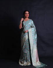 The sea green Banarsi silk saree exudes grace with its vibrant modern design intricately woven in thread and zari,- BSK010513