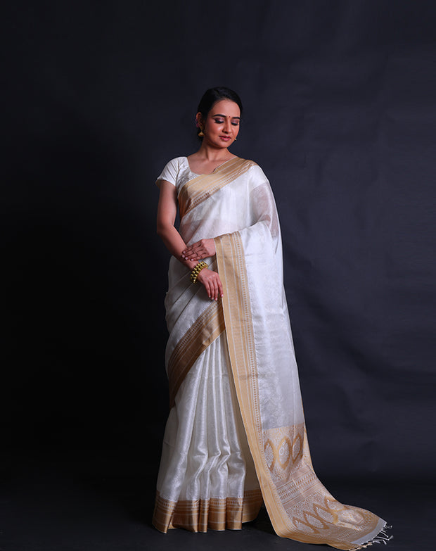 The white silk Kota saree with self design woven and beige thread woven in the border and pallu,- KSL03047