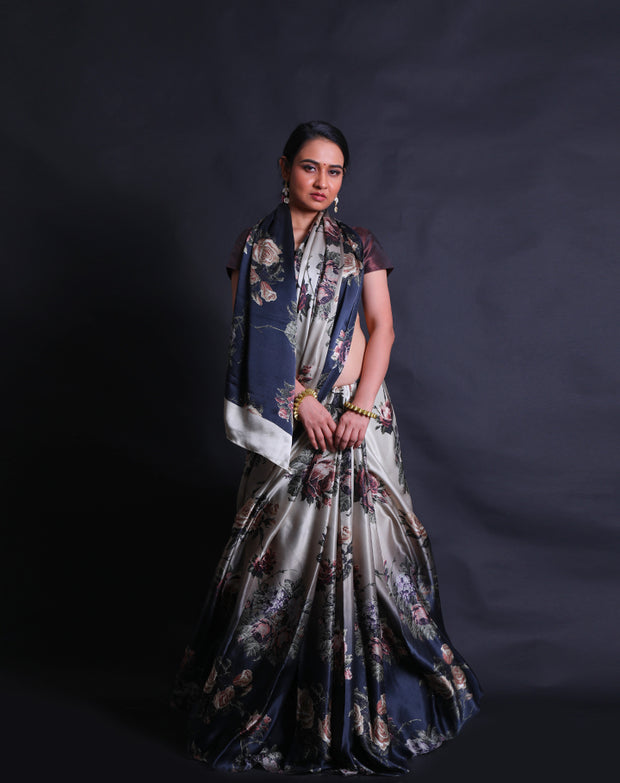 The black and white satin silk saree showcases a captivating blend of elegance and contemporary flair with its digital print in satin embroidery style adorning the entire drape.- CRP00986