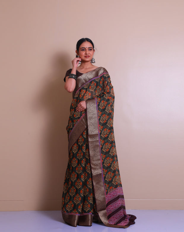 The green blended saree with big flowers printed in self and contrast sounds vibrant and lively. - BLN01274