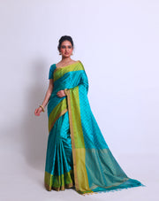 The Blue South Silk saree with small buttis woven on self-color all over the body sounds elegant and understated - KSL03058