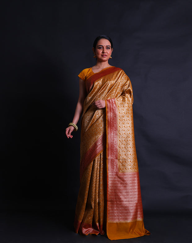 The mustard Banarasi handloom cotton saree woven in brocade style with geometrical design.- BSK010627