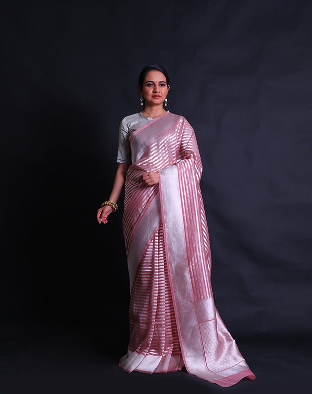 The Peach Banarasi Kora saree with silver lines woven horizontally all over the drape,- BSK010582