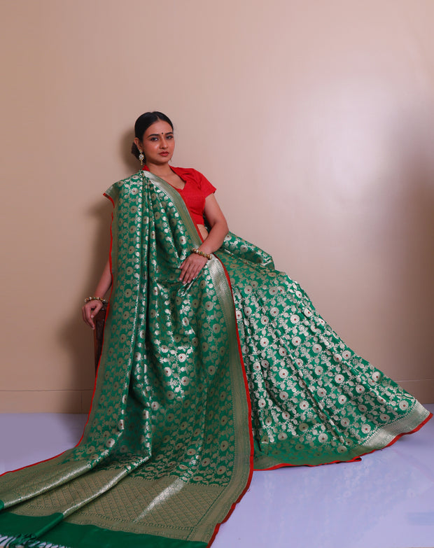 The green Banarsi silk Handloom saree with gold zari woven details all over the drape, border - BSK09932