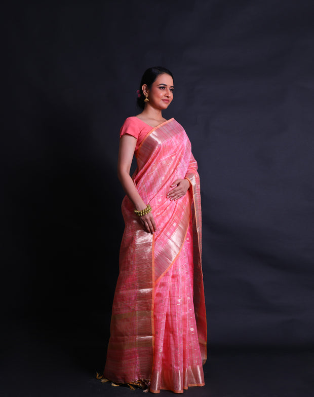 The peach cotton saree with silver zari lines and flower design all over the drape sounds elegant and charming.- FCT011146