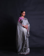 The dark grey Banarasi silk saree you're describing features a modern zig-zag design throughout,- BSK010541