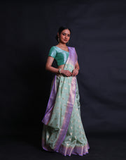 A light green blended saree features a beautiful flower design woven in zari across the drape, - BLN01556