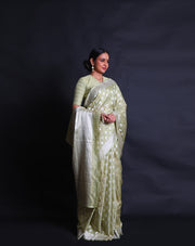 The light green Banarasi silk saree you've described sounds enchanting,- BSK010346