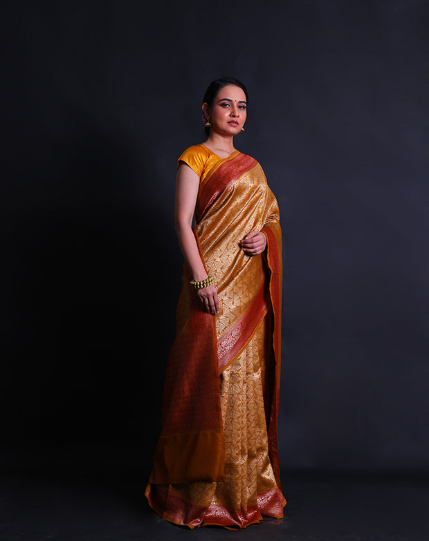 The mustard Banarasi handloom cotton saree woven in brocade style with geometrical design.- BSK010627