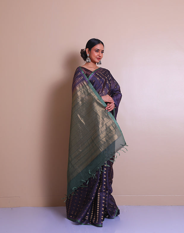 The dark mauve soft silk saree with zari triangles woven all over the drape sounds absolutely mesmerizing. - KSL03115