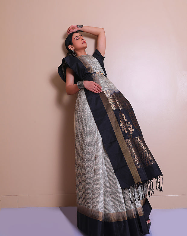 The white soft silk Kanjivaram saree with black woven geometrical designs sounds exquisite - KSL03152