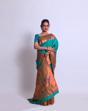 The peacock blue blended saree with Pathani parrot and raindrops zari design on the border and pallu sounds absolutely mesmerizing - BLN01289