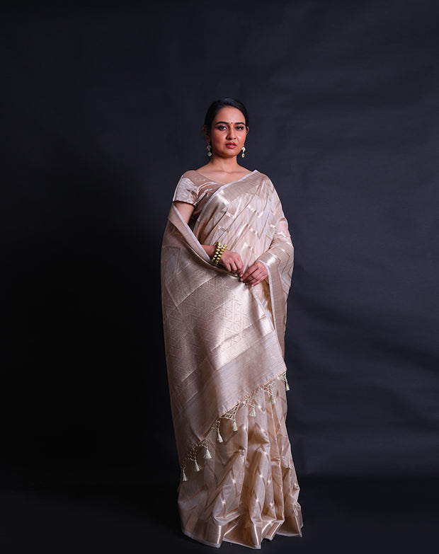 The beige fancy cotton saree, embellished with a zig-zag design woven in zari,- FCT011144