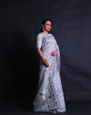 The grey pure organza saree with silver zari and shades of blue thread digitally embroidered all over the drape,- EMB03355