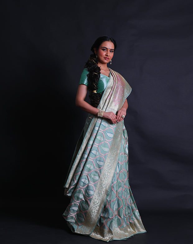 The sea green Banarsi silk saree exudes grace with its vibrant modern design intricately woven in thread and zari,- BSK010513