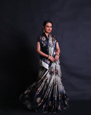 The black and white satin silk saree showcases a captivating blend of elegance and contemporary flair with its digital print in satin embroidery style adorning the entire drape.- CRP00986