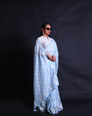 The light blue silk Kota saree adorned with thread and silver zari embroidery all over the drape sounds absolutely stunning,- EMB03354
