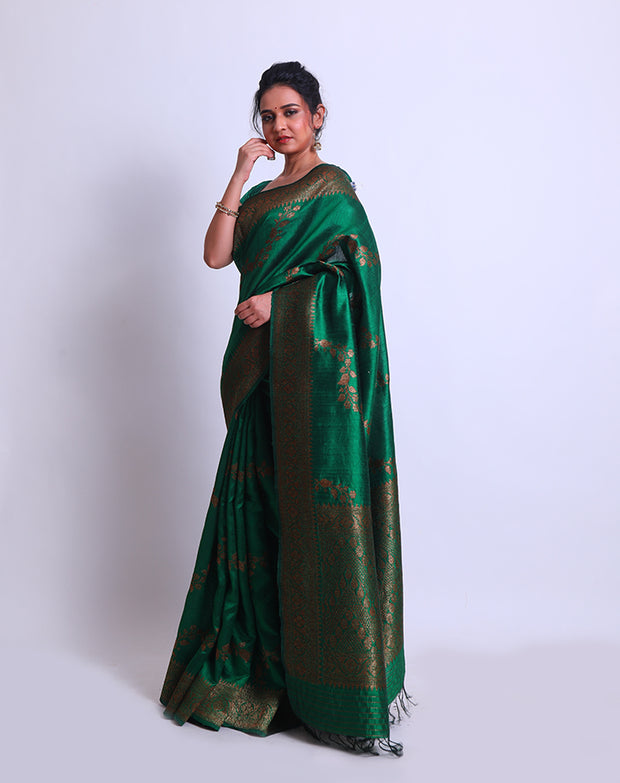 A Bottle Green Raw Silk Handloom Saree with an antique Zari border and pallu - BSK010651