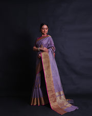 The mauve Banarasi handloom cotton saree you've described exudes elegance with its intricate details.- BSK010730