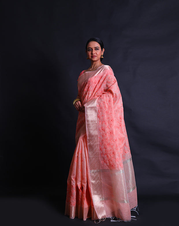 The peach blended saree with thread embroidery in flower design all over the drape sounds lovely and elegant.- BLN01558