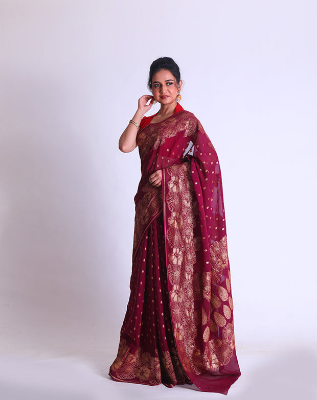 A Wine Khadi Georgette saree with Antique Zari woven on the border and pallu sounds luxurious - CHG04032