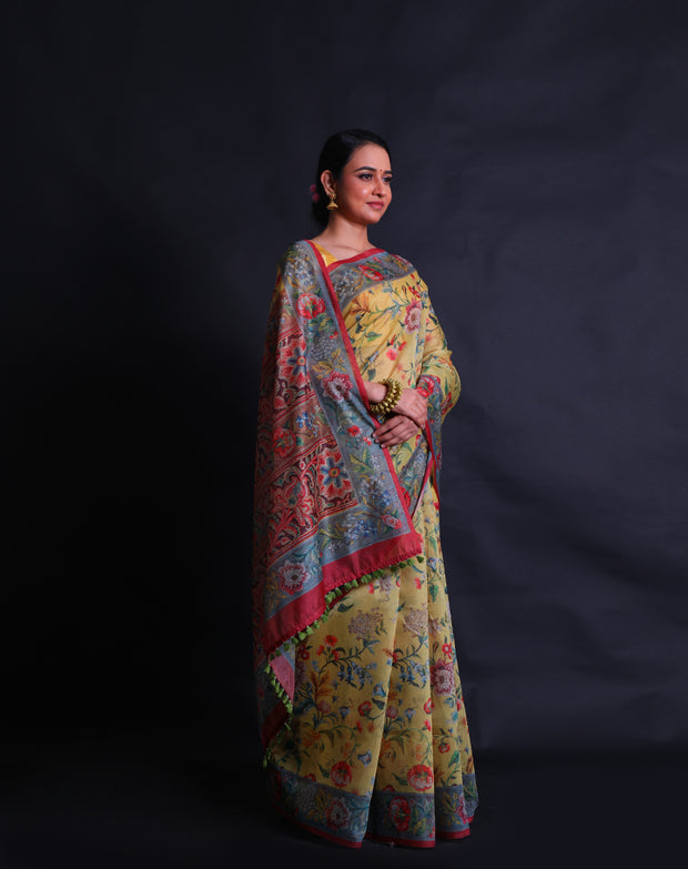 The mustard blended cotton saree with a colorful flower design printed in digital all over the drape sounds vibrant and charming,- BLN01345