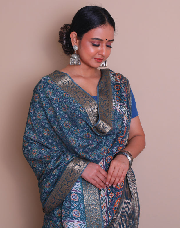 The blue blended saree with Ajrakh print all over the drape sounds absolutely stunning! - BLN01001