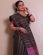 The brown soft silk saree with green thread woven in a geometrical design all over the drape - KSL03125